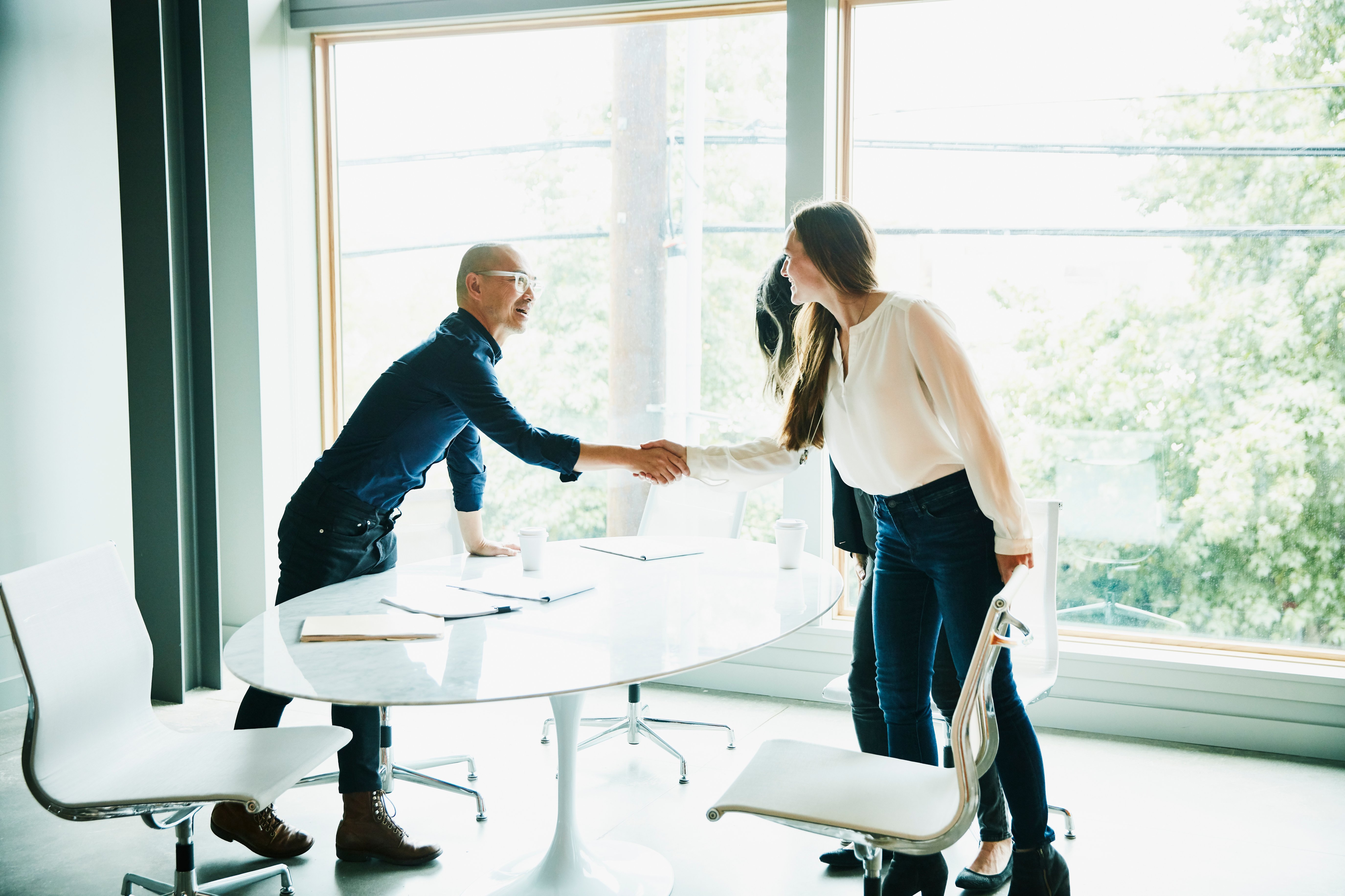 man and woman shaking hands