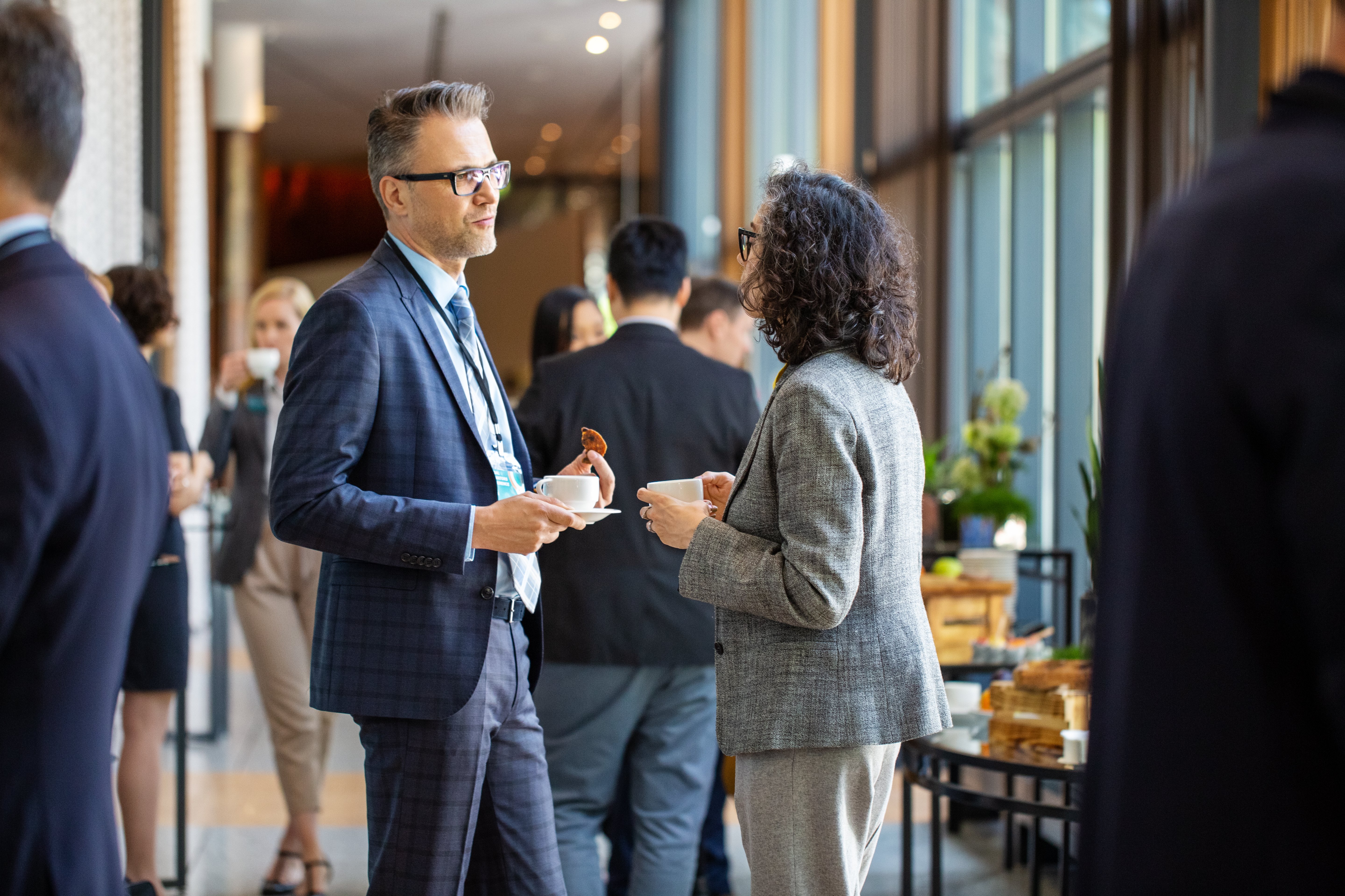man and woman having coffee and talking