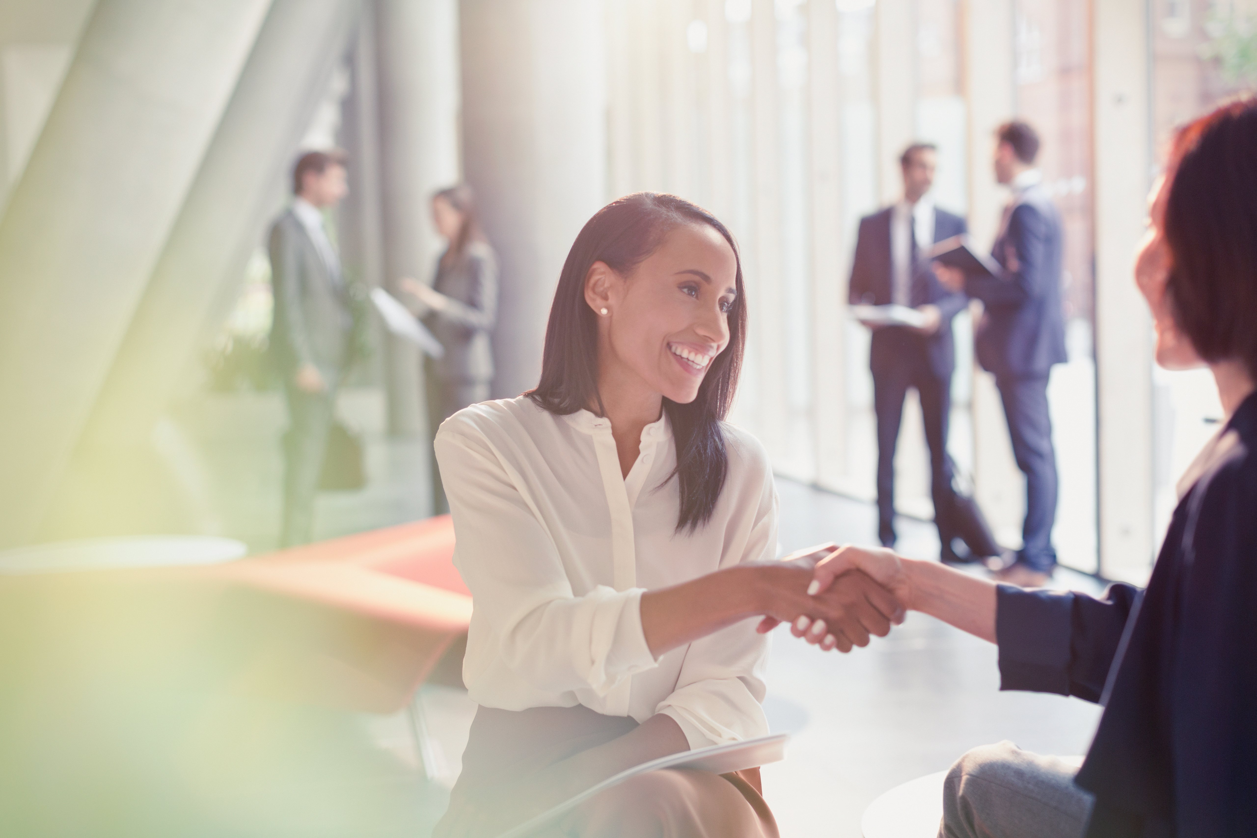 women shaking hands