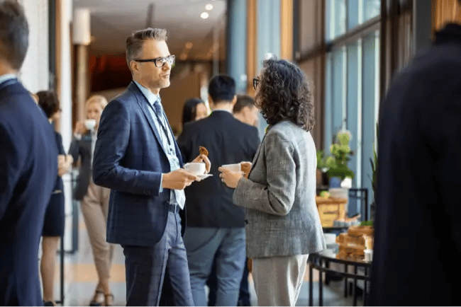 man and woman having coffee and talking