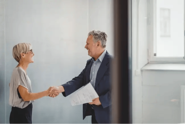 man and woman shaking hands