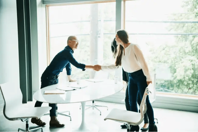 man and woman shaking hands