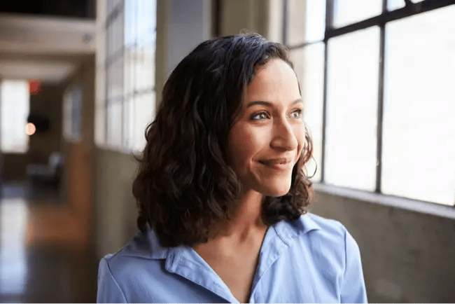 happy woman by window