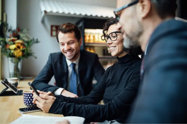 woman smiling at phone